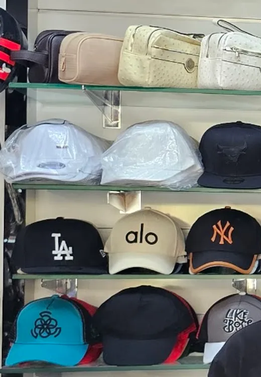 Caps on the shelves inside the shop