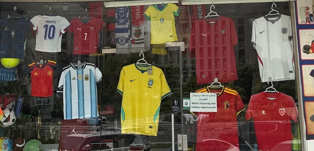 France, Spain, Argentina, Brazil and England jerseys hanging in the shop doorway