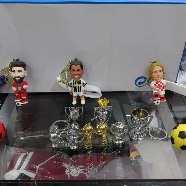 Small trophies and football player figures on the counter